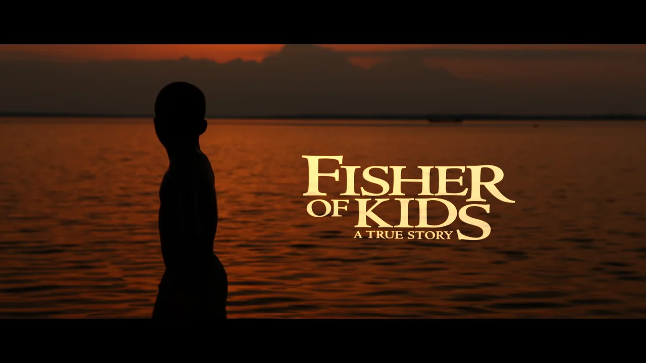 Fisher of Kids—the title frame, a boy silhouetted against sunset on Lake Volta